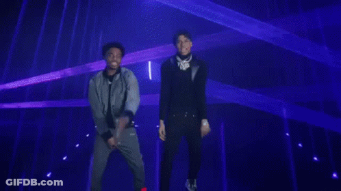 Man In Black Jacket Facing Blue Lights GIF