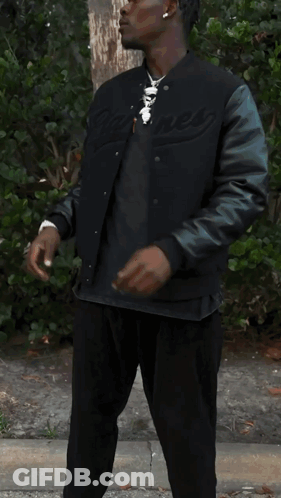 Man In Black Jacket Holding Bag Of Ice Cream GIF
