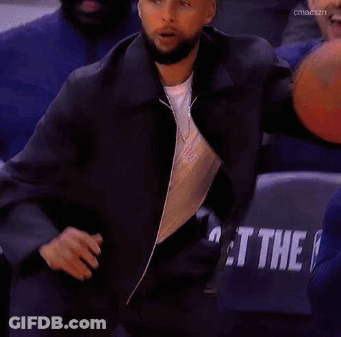 Man In Black Jacket Holding Basketball Thumbs Up GIF