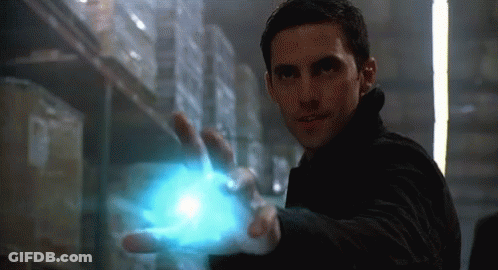 Man In Black Jacket Holding Blue Object GIF
