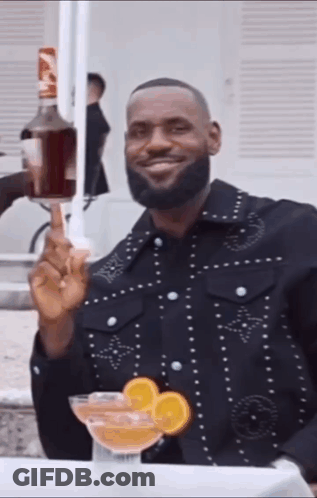 Man In Black Jacket Holding Bottle Of Alcohol GIF