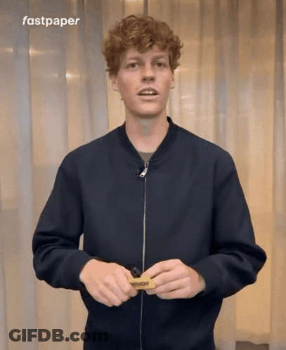 Man In Black Jacket Holding Fastpaper Sign GIF