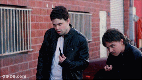 Man In Black Jacket Holding Knife GIF