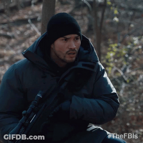 Man In Black Jacket Holding Rifle FBLS GIF