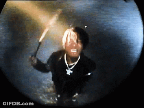 Man In Black Jacket Holding Torch Dark Room GIF