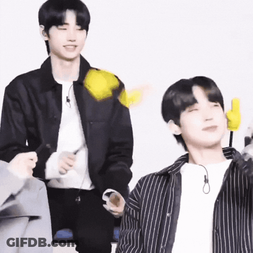 Man In Black Jacket Holding Yellow Object, Watcher GIF