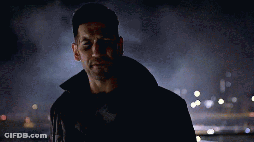 Man In Black Jacket In City At Night GIF
