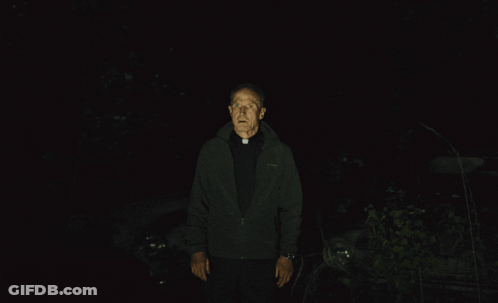 Man In Black Jacket In Dark GIF