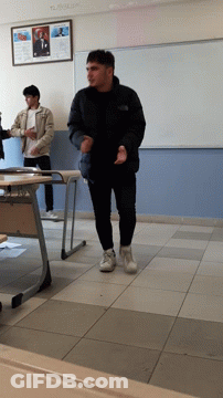 Man In Black Jacket In Front Of Ataturk Sign GIF