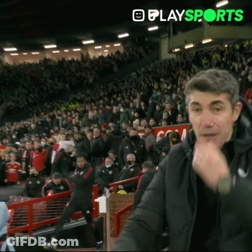 Man In Black Jacket In Front Of Crowd GIF