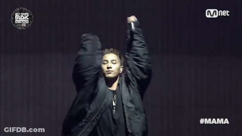 Man In Black Jacket In Front Of Mnet Sign GIF