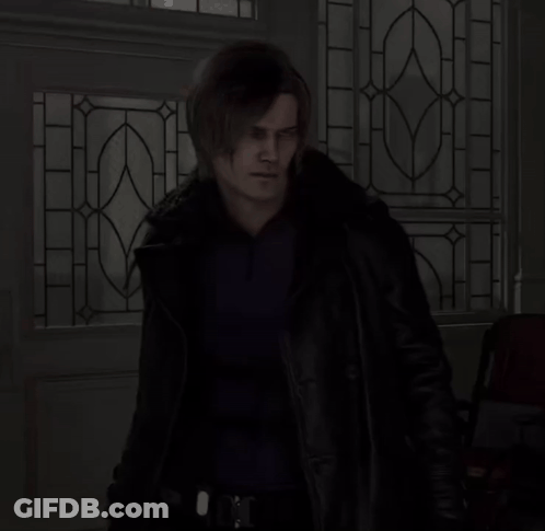 Man In Black Jacket In Front Of Stained Glass Door GIF
