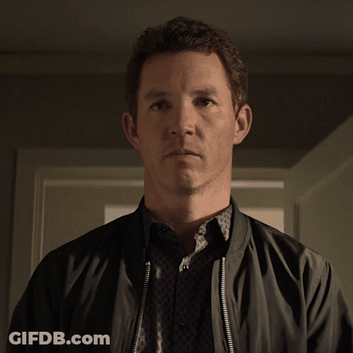 Man In Black Jacket Looking At Camera GIF