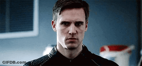 Man In Black Jacket Looking At Camera GIF