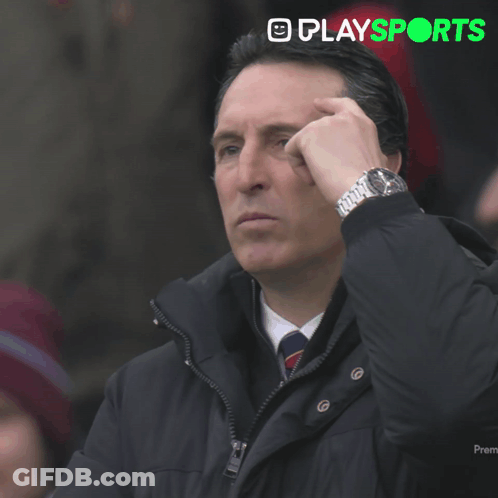 Man In Black Jacket Looking At Watch With Playsports Logo GIF