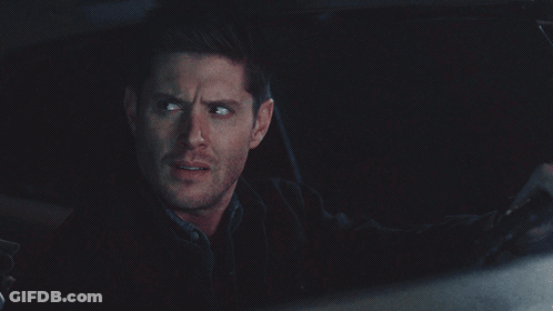 Man In Black Jacket Looking In Dark GIF