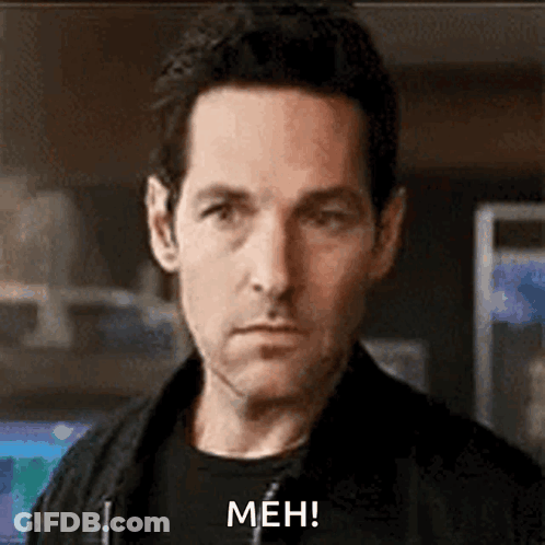Man In Black Jacket Making Meh Face GIF