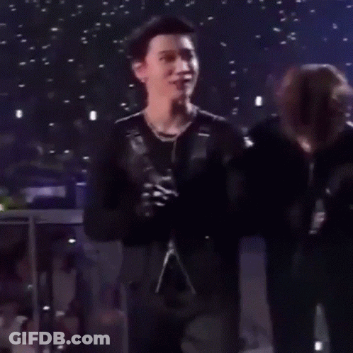 Man In Black Jacket Next To Another Man GIF