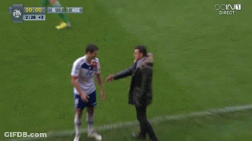 Man In Black Jacket Next To Man In White Shirt GIF