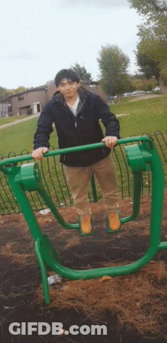 Man In Black Jacket On Green Machine GIF