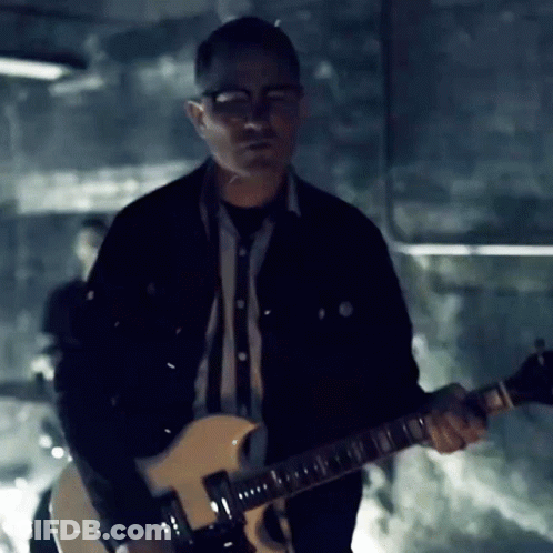 Man In Black Jacket Playing Guitar GIF