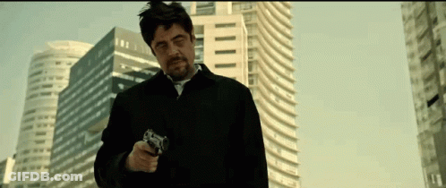 Man In Black Jacket Pointing Gun GIF
