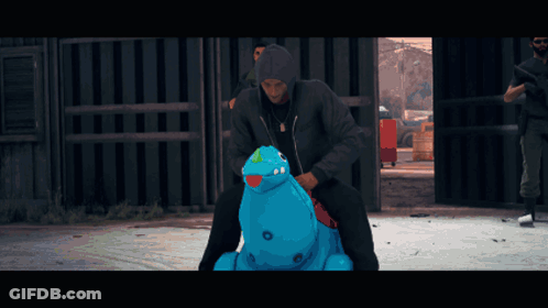 Man In Black Jacket Riding Blue Inflatable Hippopotamus GIF