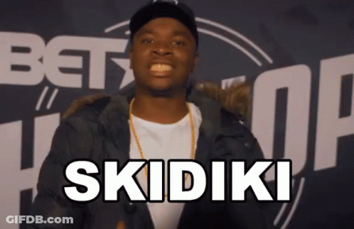 Man In Black Jacket Says Skidiki In Front Of BET Logo GIF
