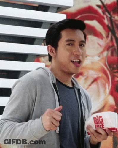 Man In Black Jacket Shopping With Basket Of Snacks GIF
