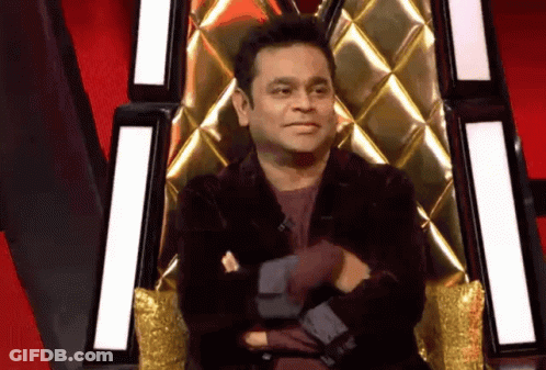 Man In Black Jacket Sitting Crossed Arms GIF