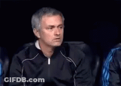 Man In Black Jacket Sitting In Dark Room With Cigarette GIF