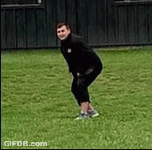 Man In Black Jacket Squatting GIF