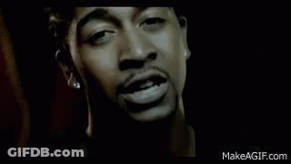 Man In Black Jacket Standing In Dark Room GIF