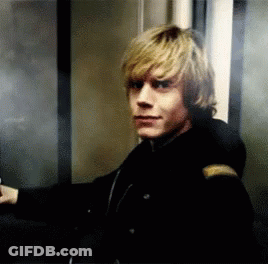 Man In Black Jacket Standing In Elevator GIF