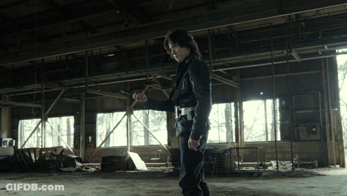Man In Black Jacket Standing In Empty Room GIF