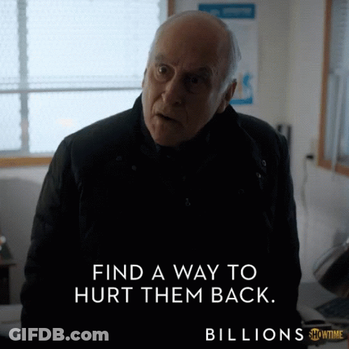 Man In Black Jacket Standing In Front Of Billions Sign GIF