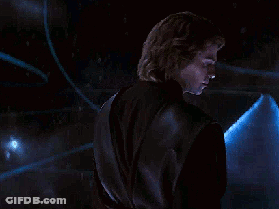 Man In Black Jacket Standing In Front Of Blue Object GIF