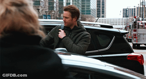 Man In Black Jacket Standing Next To Black Car GIF
