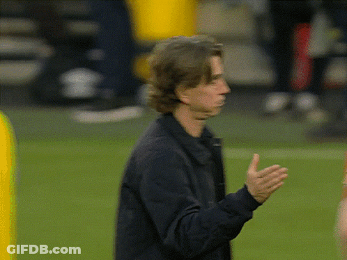 Man In Black Jacket Standing On Field GIF