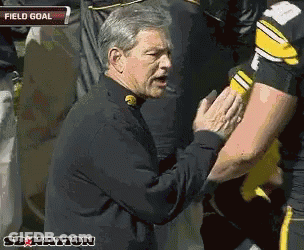 Man In Black Jacket Talking To Football Player Field Goal GIF