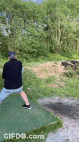 Man In Black Jacket Throwing Frisbee GIF