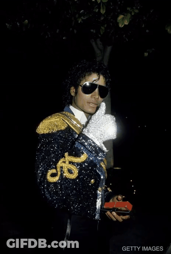 Man In Black Jacket White Glove Peace Sign GIF