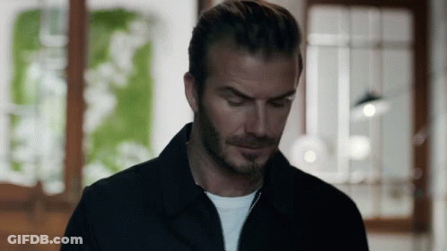 Man In Black Jacket White Shirt Looking Down GIF