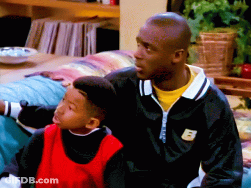Man In Black Jacket With B Beside Boy GIF