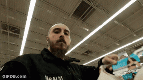 Man In Black Jacket With Balm Text GIF