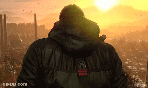 Man In Black Jacket With Peaks At Sunset GIF