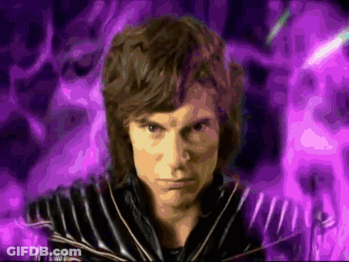 Man In Black Jacket With Purple Background GIF