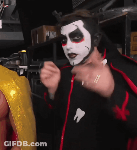 Man In Black Jacket With Tooth GIF