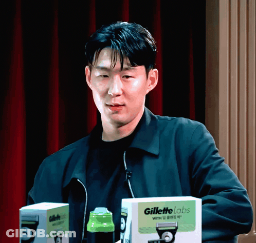 Man In Black Jacket With Two Gillette Razor Boxes GIF