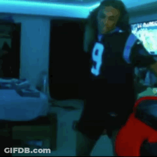 Man In Black Jersey Number 9 Dancing In Dark Room GIF